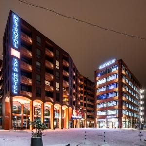 a rendering of a hotel at night at Rotermann Square view Apartment in Tallinn