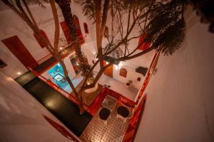 an overhead view of a house with a tree at Riad O LY in Marrakesh