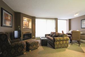 a living room with a couch and chairs and a television at Marquise Condos by Whistler Retreats in Whistler