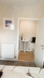 a bathroom with a sink and a toilet at Haddington George House in Edinburgh