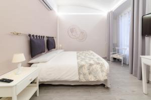Un pat sau paturi într-o cameră la Re Vittorio