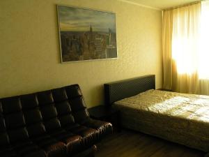 Ένα ή περισσότερα κρεβάτια σε δωμάτιο στο Apartments on Buinskiy 1