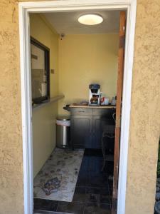 a kitchen with a sink and a counter top at Glendora Motel in Glendora