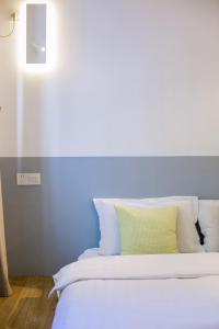 Ένα ή περισσότερα κρεβάτια σε δωμάτιο στο HOME++ Xi'an