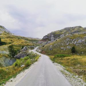 a winding road in the middle of a mountain at Exo Log Cottage in Jezero