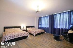 Postel nebo postele na pokoji v ubytování Tata House B&B