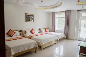 מיטה או מיטות בחדר ב-Thanh Xuan Hotel