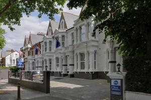 
a row of houses on the side of a road at Best Western Chiswick Palace & Suites London in London
