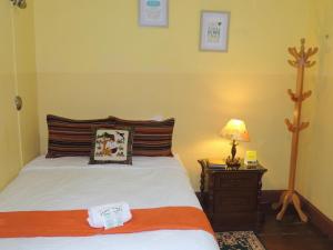 Cama ou camas em um quarto em Lima Wari Hotel Boutique
