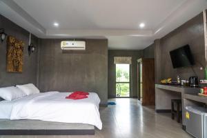 Ein Bett oder Betten in einem Zimmer der Unterkunft Chomview Resort