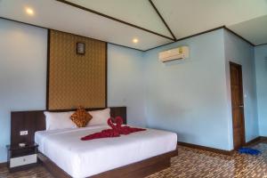 Ein Bett oder Betten in einem Zimmer der Unterkunft Chomview Resort