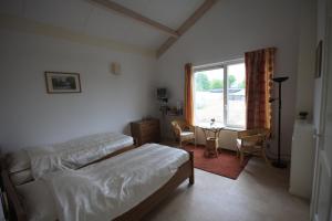 Postel nebo postele na pokoji v ubytování Boerderij "De Verwondering"