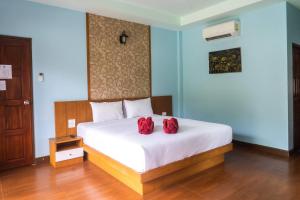 Ein Bett oder Betten in einem Zimmer der Unterkunft Chomview Resort