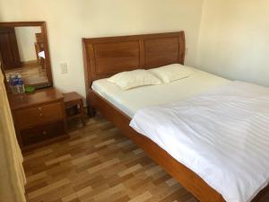 Postel nebo postele na pokoji v ubytování Thảo Chi