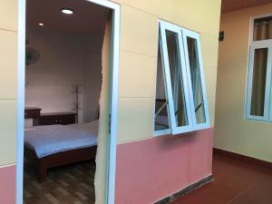 Postel nebo postele na pokoji v ubytování Thảo Chi