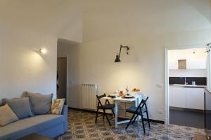 a living room with a couch and a table at La Piazzetta in Bordighera