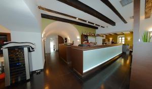 a restaurant with a bar and a wine cellar at pension N.10 in Frymburk