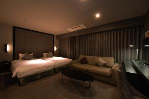 Letto o letti in una camera di Hotel Trusty Nagoya Shirakawa