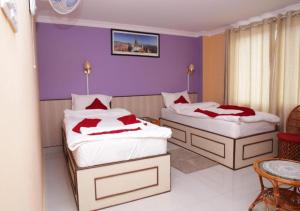 Postel nebo postele na pokoji v ubytování Hotel Tranquil