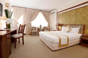 Postel nebo postele na pokoji v ubytování Palace Hotel Vung Tau