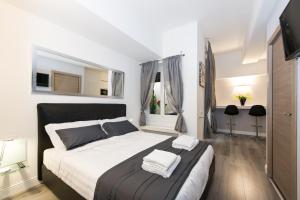 a bedroom with a large bed and a window at Brunelleschi Luxury Holidays in Rome