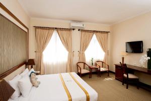 Postel nebo postele na pokoji v ubytování Palace Hotel Vung Tau