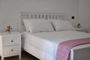 Postel nebo postele na pokoji v ubytování CASA SACA'