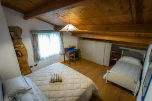 Łóżko lub łóżka w pokoju w obiekcie La Tinaia Country House