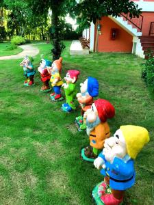 a row of mickeys lined up in the grass at Villa De Bua Resort Nan in Nan
