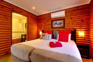 Voodi või voodid majutusasutuse Sunset Lodge toas