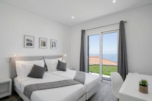Ένα ή περισσότερα κρεβάτια σε δωμάτιο στο Villa Canavial +8 φωτογραφίες