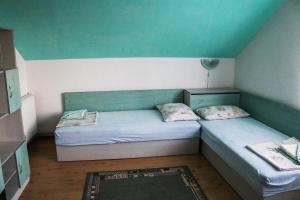 A bed or beds in a room at Nature Guesthouse