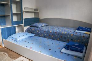 A bed or beds in a room at Nature Guesthouse