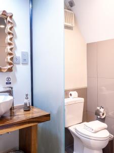 a bathroom with a toilet and a sink at Deevana Krabi Resort in Ao Nang Beach