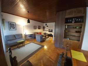 a living room with a couch and a table at Apartment in the heart of the city in Skopje