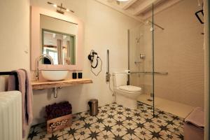 a bathroom with a sink and a toilet and a shower at Caserio Montehermoso in Astúlez +151 photos