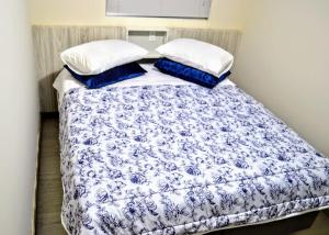 Säng eller sängar i ett rum på Ideal Lages Hotel