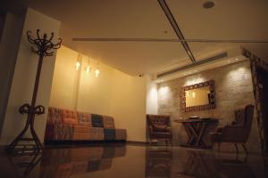 a living room with a couch and a table at Yaldiz Palace Hotel in Nablus