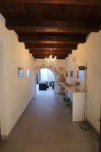 a large hallway with a ceiling with a chandelier at Italiana Resort Atrio in Siracusa