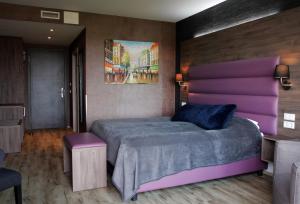 Postel nebo postele na pokoji v ubytování Hotel Kriunes