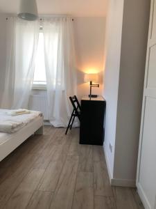 Televizors / izklaižu centrs naktsmītnē Apartament Parion