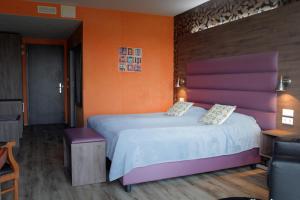 Postel nebo postele na pokoji v ubytování Hotel Kriunes