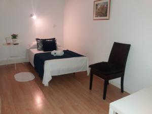 A bed or beds in a room at Casa de Huéspedes Prada