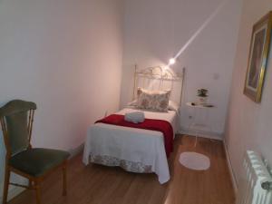 A bed or beds in a room at Casa de Huéspedes Prada