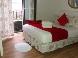 A bed or beds in a room at Casa de Huéspedes Prada
