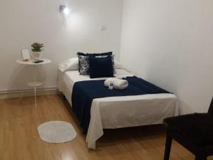 A bed or beds in a room at Casa de Huéspedes Prada
