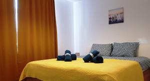 a bedroom with a bed with two teddy bears on it at Carpen View Residence in Săcele