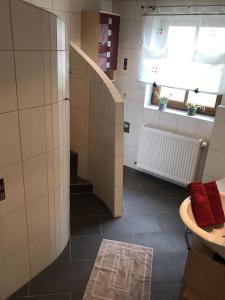 a small bathroom with a staircase and a window at Zollern-Alb Aktiv in Albstadt