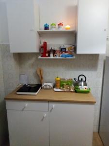 a kitchen with a counter top with a sink at B&Bari in Bari
