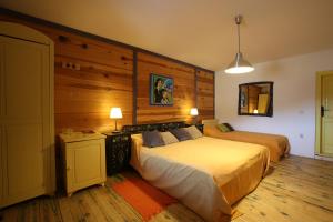 A bed or beds in a room at Mecavnik Resort